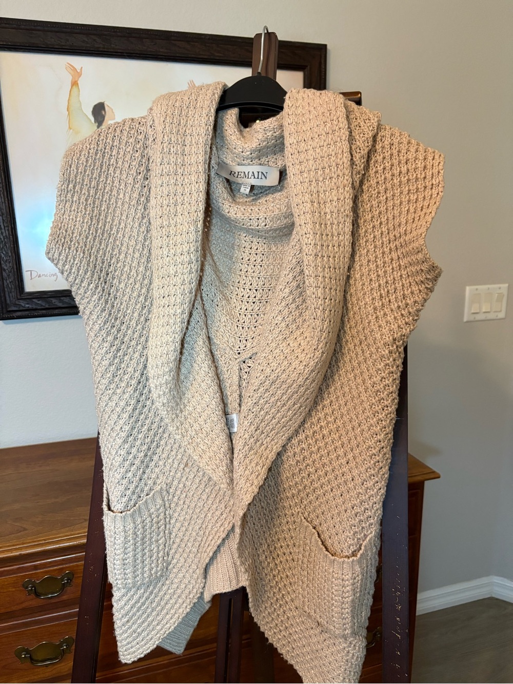 REMAIN Sleeveless Open-Front Knit Cardigan Vest in Beige.